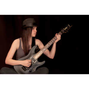 I saw an amazing picture on a web site of this female guitarist.  She was beautiful.  After a bit of searching, I was able to contact her and we did this shoot together.